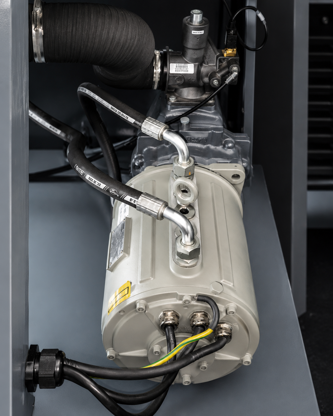 Industrial electric motor installed inside compressor equipment housing